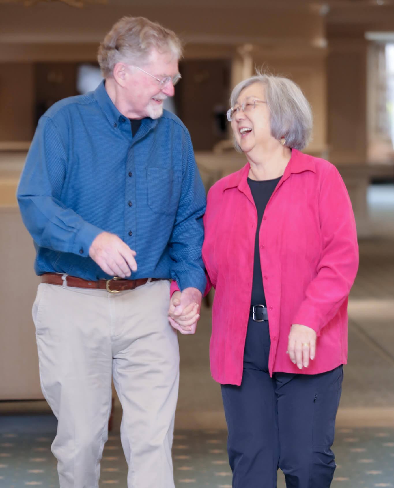 Margie Yamamoto and Mark Hopkins Holding Hands and Laughing