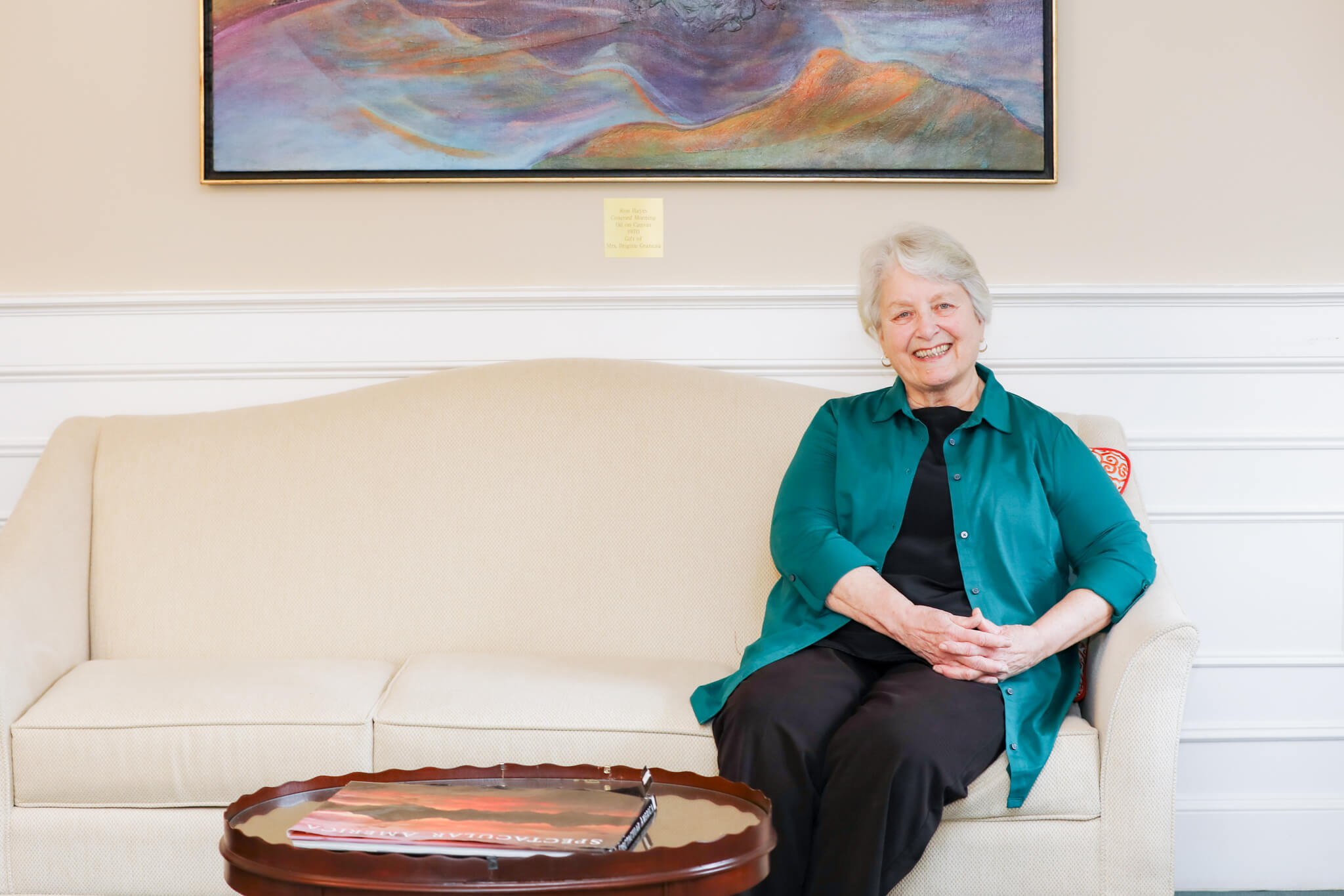 Marcia Bradley Sitting on Couch