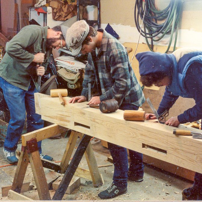 Group of Men Carving a Beam