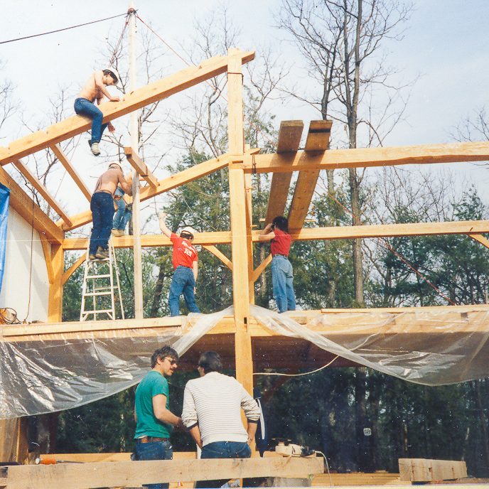 Group of People Constructing a House