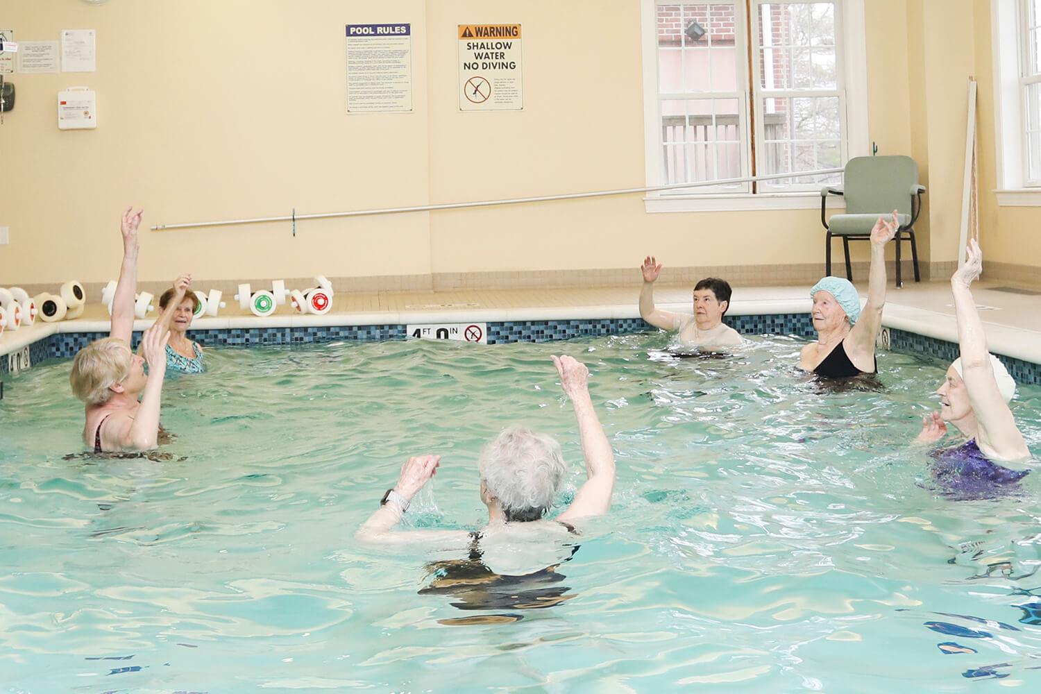 Women Preforming Water Aerobics  