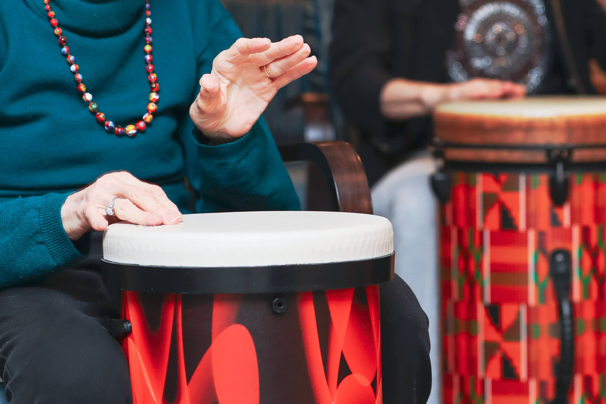 Woman Playing Drum with Her Hands