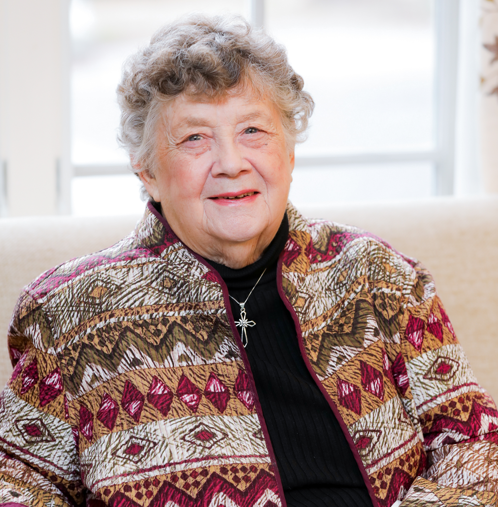 Lilian Warner Sitting on Couch