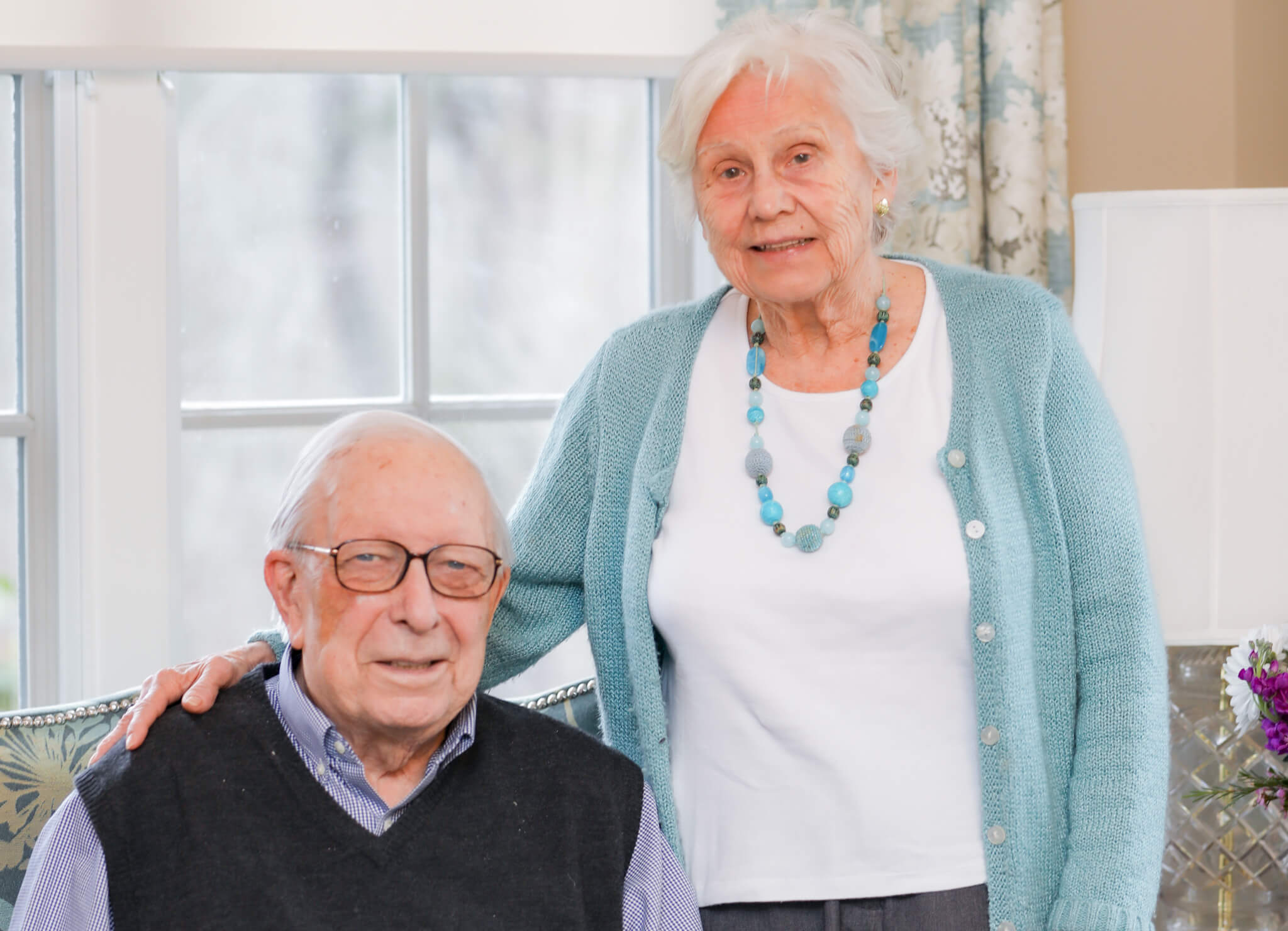 Katharine Esty and Peter Gunness in front of window